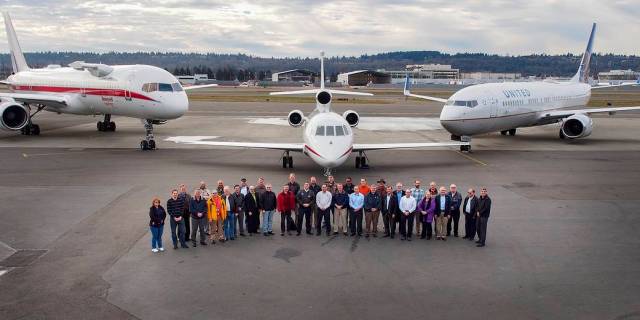 ATD-1 team posing in front of 3 aircraft.