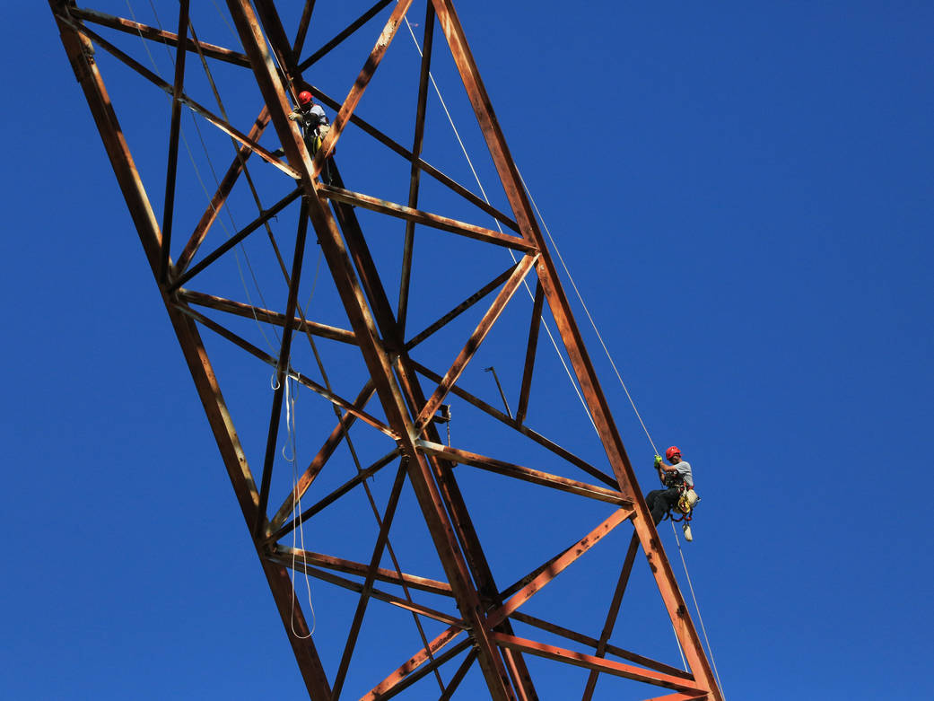 Technicians perform a structural inspection of NASA Langley's Landing and Impact Research Facility