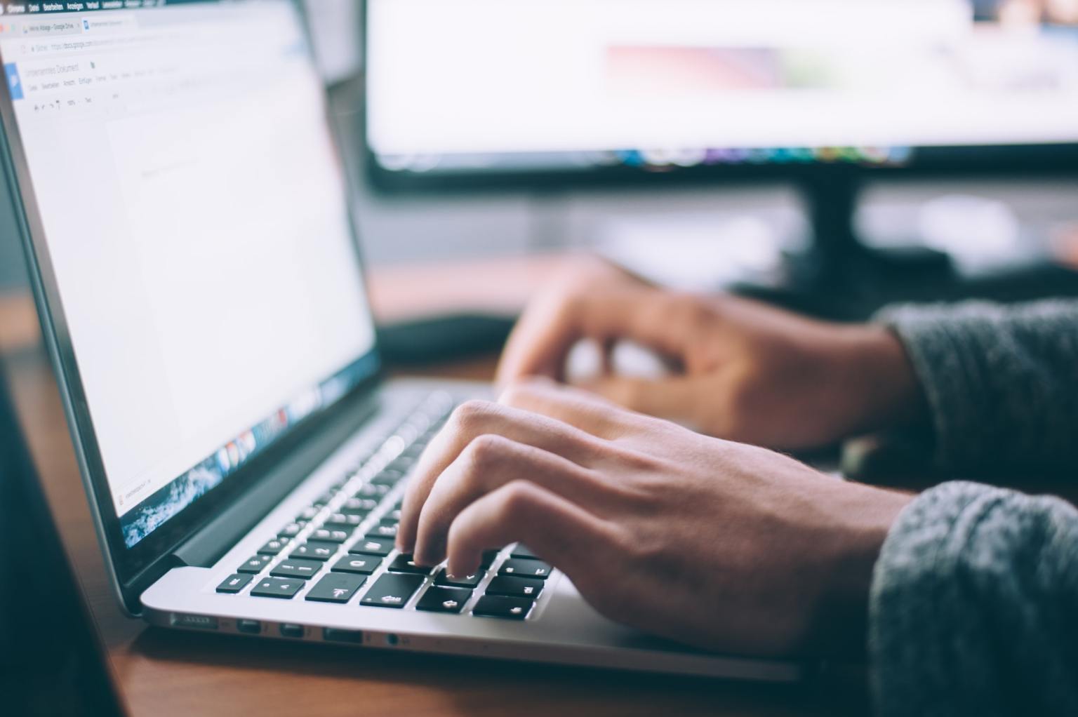 A person typing on a computer