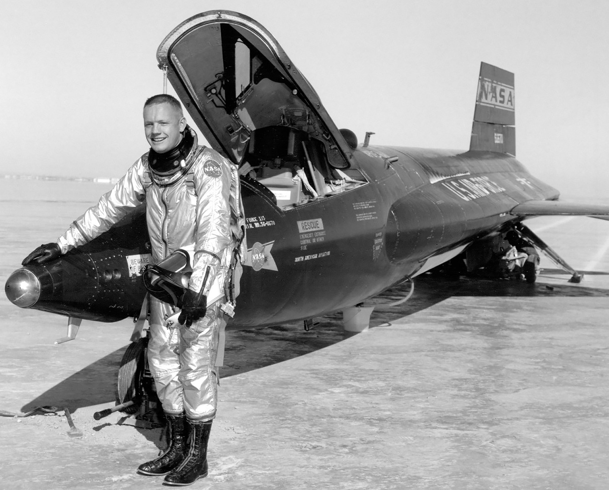 Neil Armstrong standing in front of X-15.