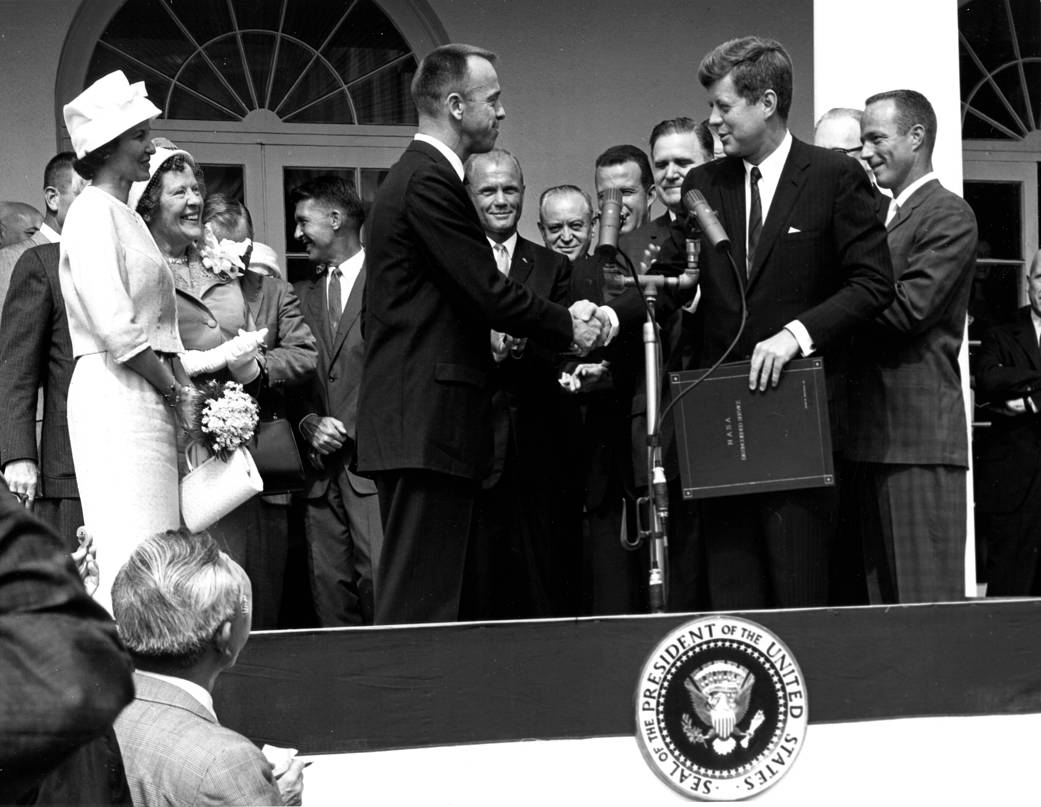 President John F. Kennedy congratulates astronaut Alan B. Shepard, Jr., the first American in space, on his historic May 5th, 19
