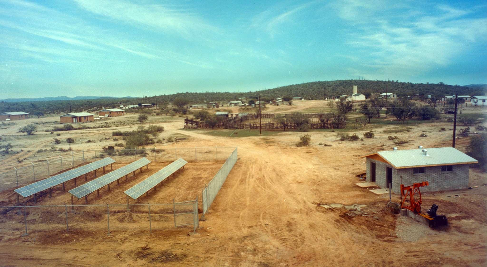 Arizona village with rows of solar panels.