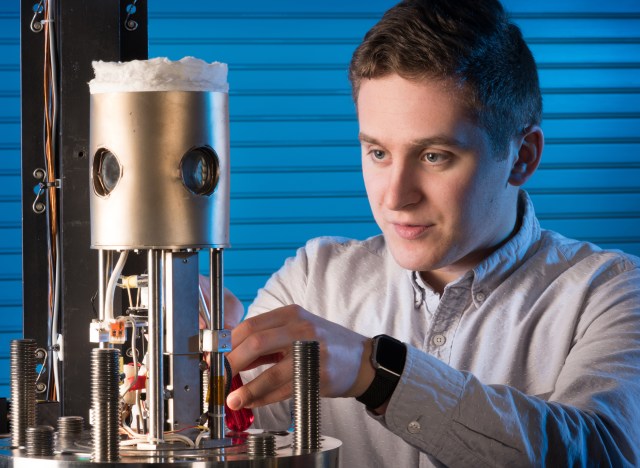 image of a researcher testing hardware in a lab