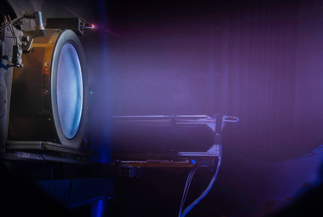 An engineering model firing inside a Glenn vacuum chamber.
