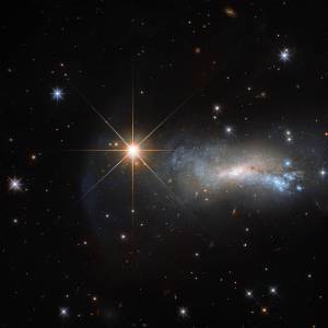 Hubble image of a star and galaxy in Lacerta