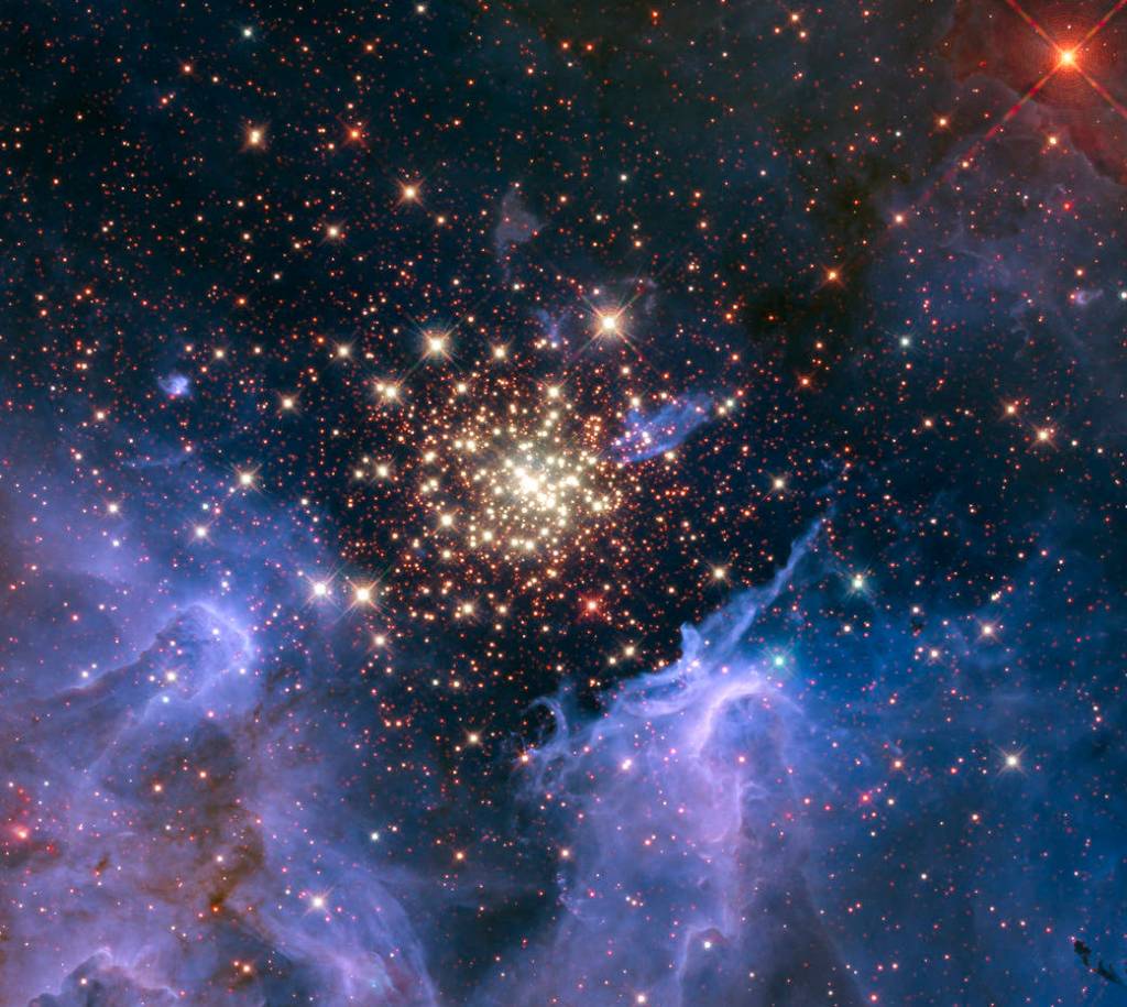 NGC 3603, a young, glittering collection of stars, looks like an aerial burst.