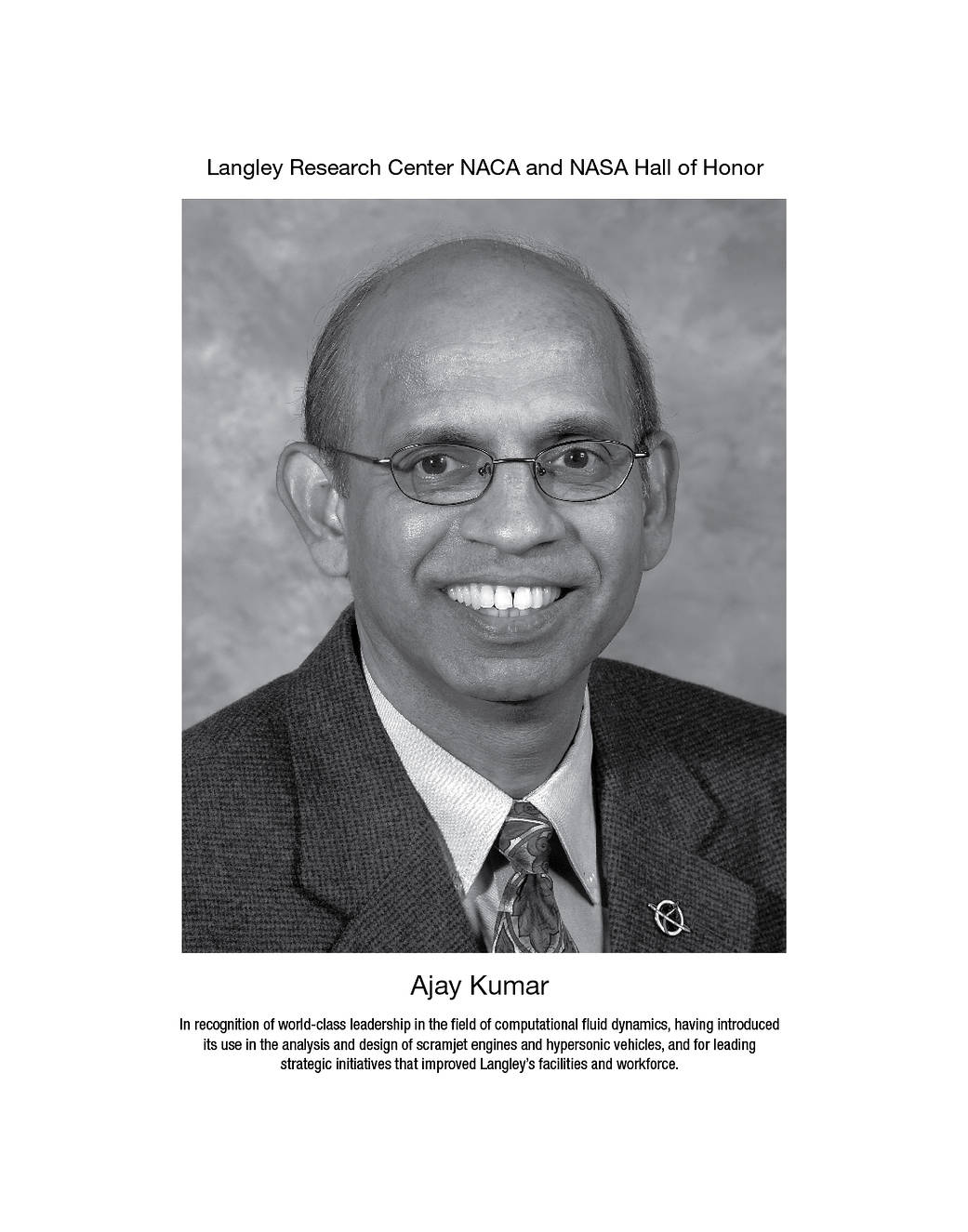 A portrait of Ajay Kumar.