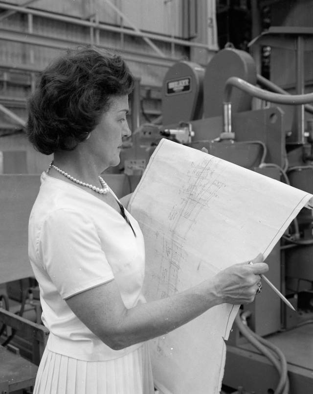 Margaret W. ‘Hap’ Brennecke reviews blueprints in the Manufacturing and Engineering Laboratory at Marshall Space Flight Center.