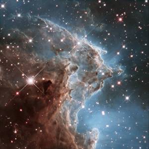 This colorful Hubble Space Telescope mosaic of a small portion of the Monkey Head Nebula unveils a collection of carved knots of