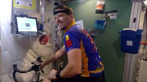 HERA crew member Christopher Roberts rides an indoor bicycle inside a tiny habitat that NASA uses to help simulate missions to Mars. 

