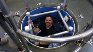 HERA crew member Christopher Roberts ascends a ladder inside a small habitat that NASA uses to simulate missions to Mars.