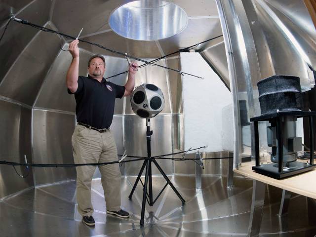 An acoustic engineer tests the MPCV mockup.