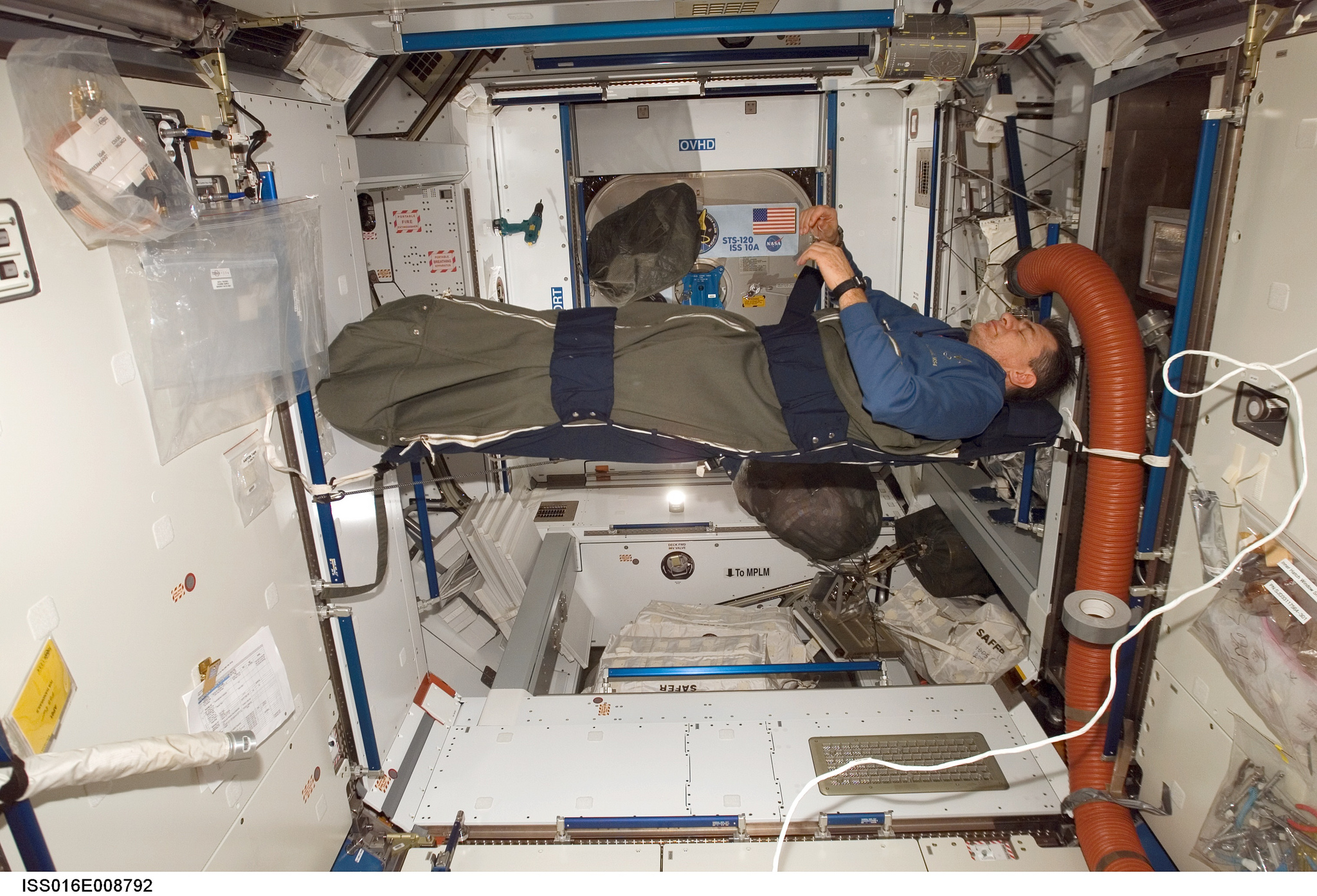 astronaut rests in his sleeping bag