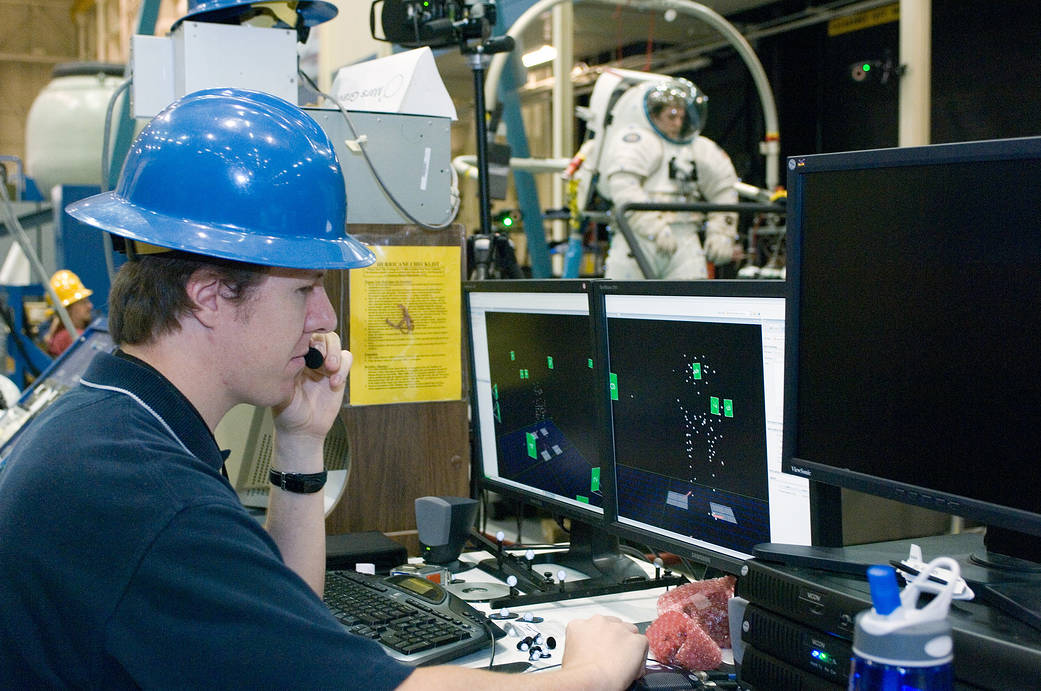 Human factors expert monitors a motion analysis system during an extravehicular activity (EVA) systems engineering test