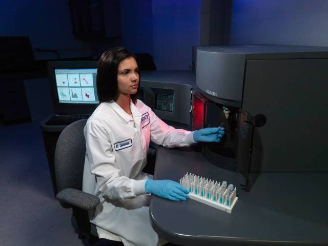 An Immunology lab researcher works with samples
