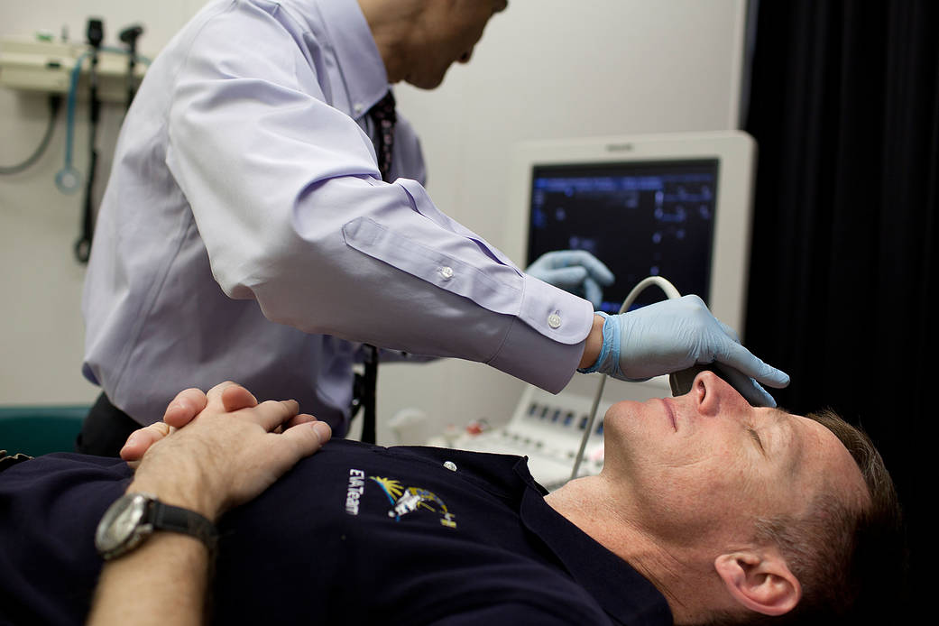 NASA astronaut Chris Ferguson has his eyes imaged using ultrasound 