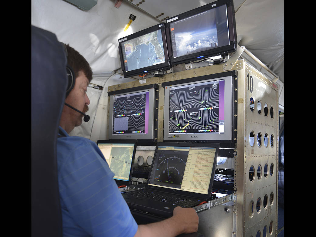 Researchers Steven Harrah monitors displays showing the DC-8 flight track.
