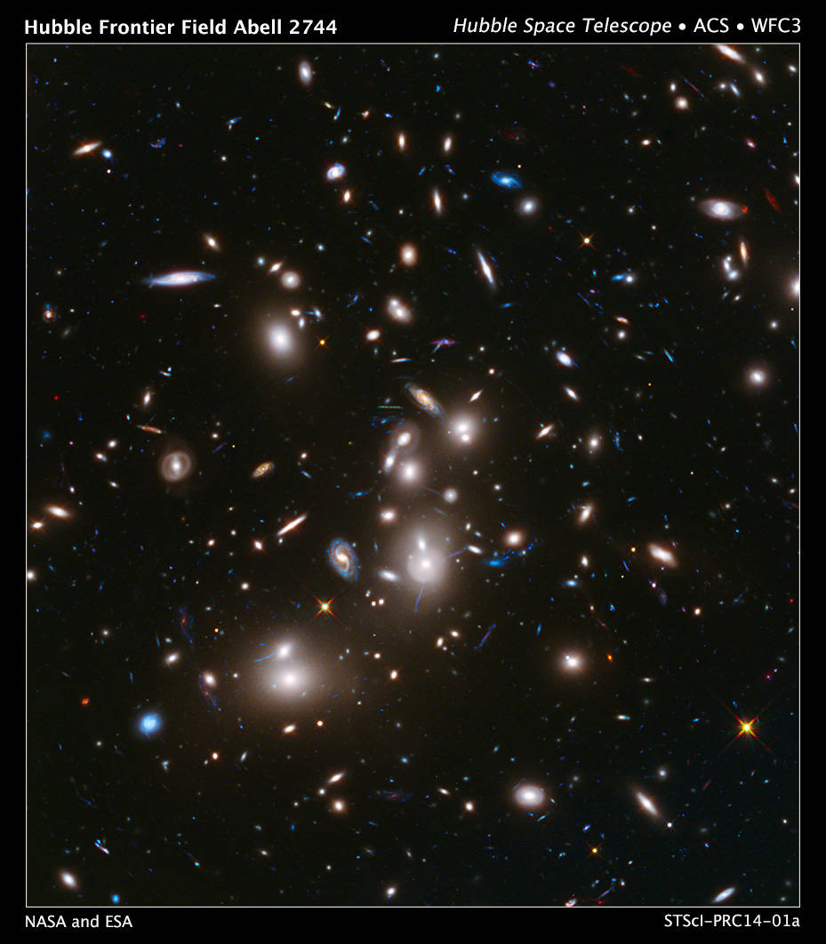 This long-exposure Hubble Space Telescope image of massive galaxy cluster Abell 2744 (foreground) is the deepest ever made of an