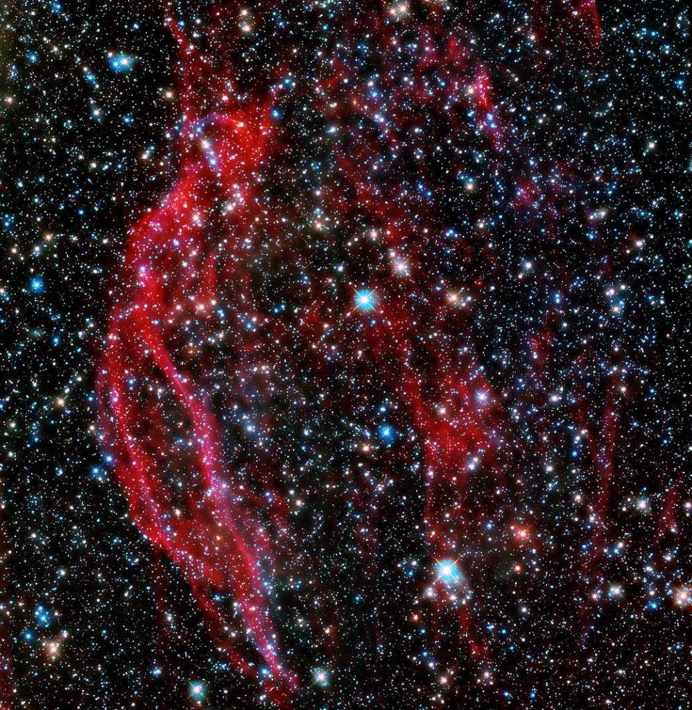 Hubble Space Telescope images the glowing red tendrils of gas from the supernova remnant, DEM L249.