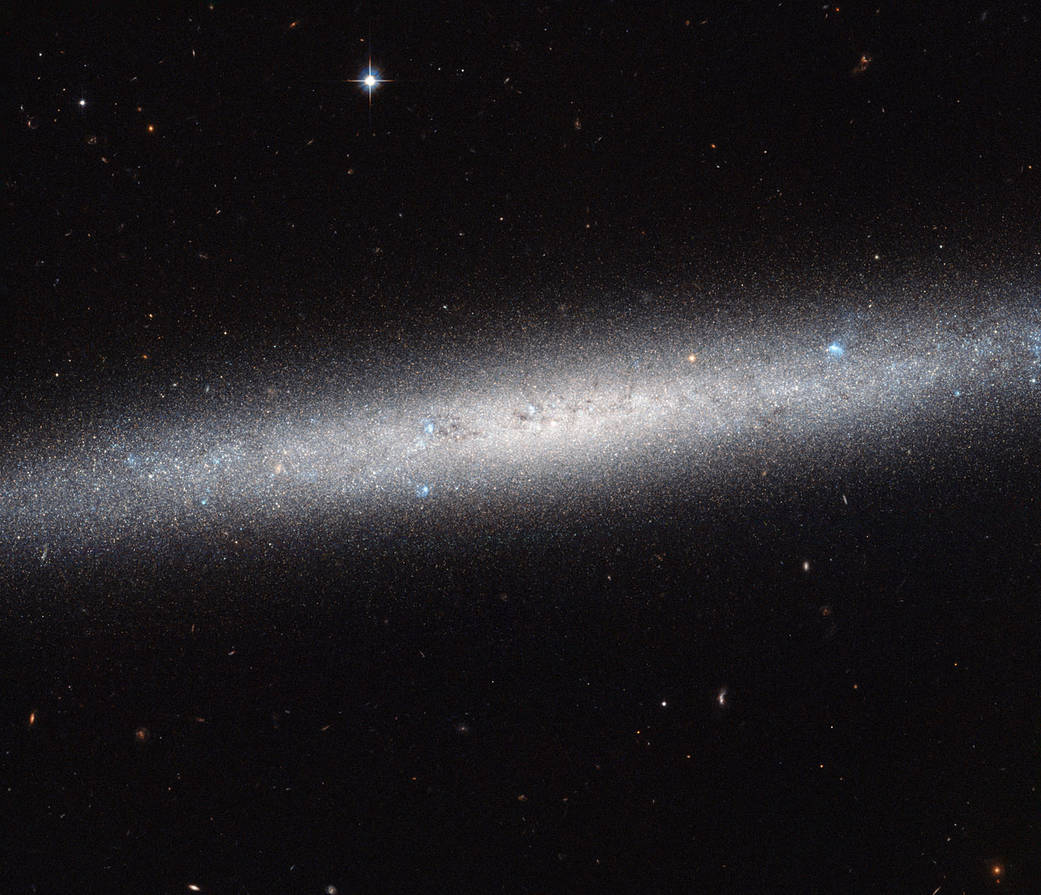 an elliptical formation of stars on a black background