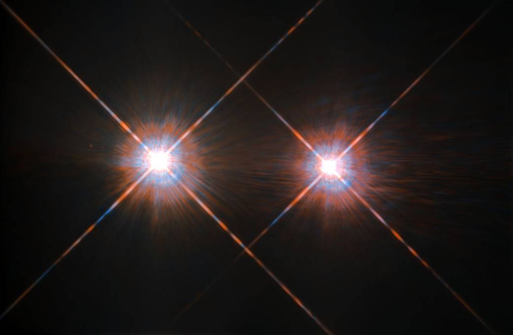 Alpha Centauri A and B glow against a black sky
