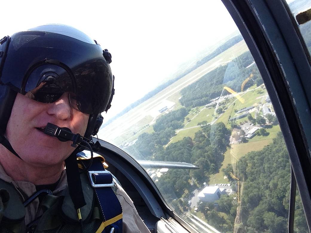 This image shows pilot Rich Rogers flying a T34 aircraft over Wallops Flight Facility.