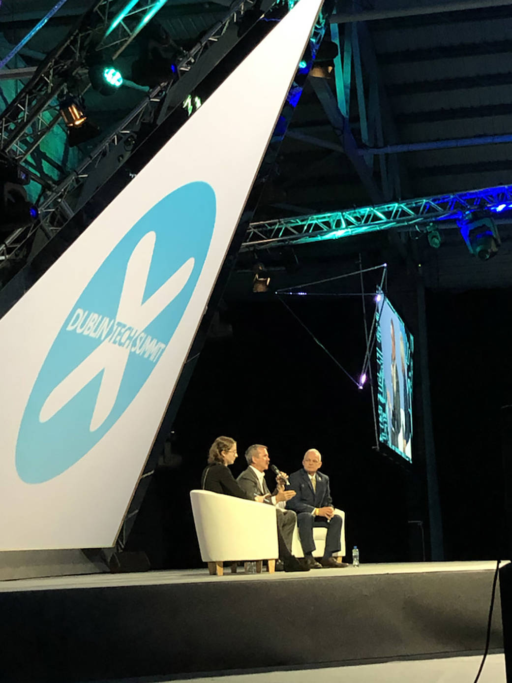 Three people sitting and talking