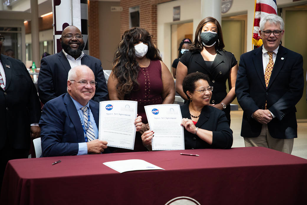 NASA's Goddard Space Flight Center Director Dennis Andrucyk and UMES President Dr. Heidi Andersen hold up the signed Space Act Agreement with University of Maryland Eastern Shore and NASA.
