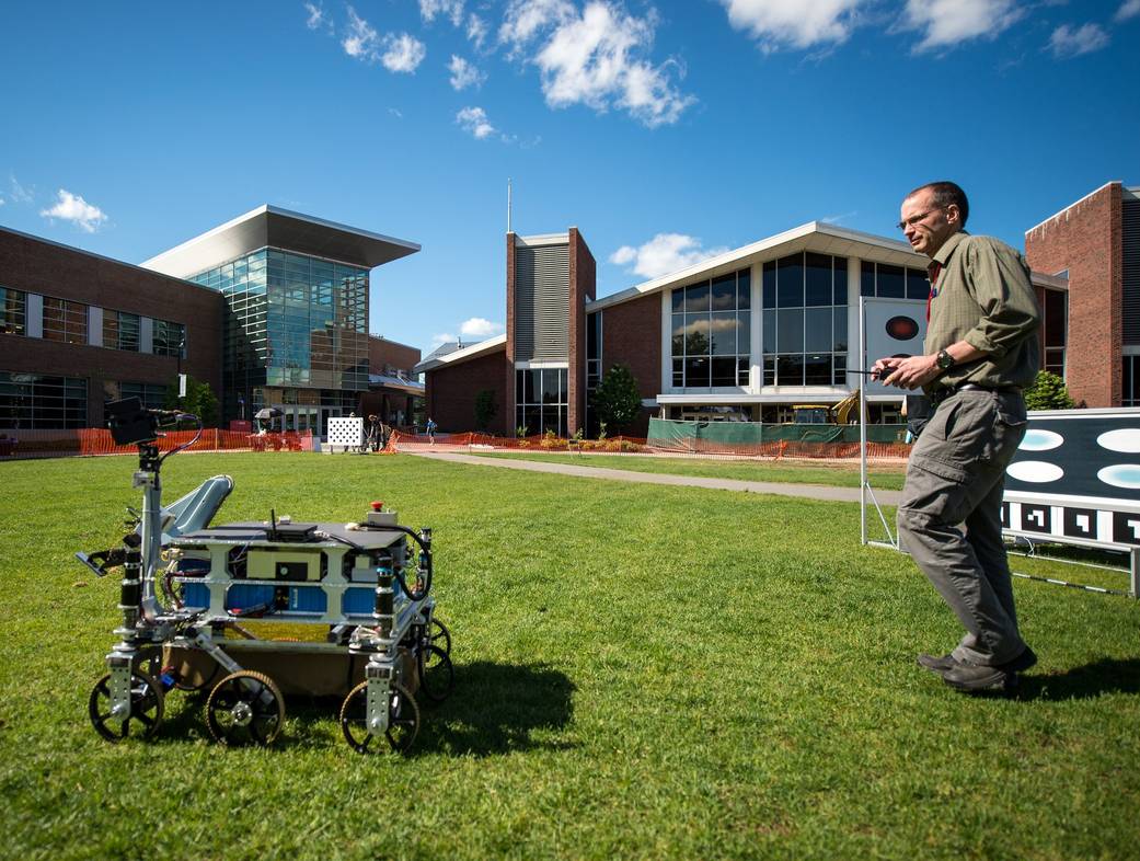 Mark Curry of Intrepid Systems from Lynnwood, Wash. monitors his robot in the practice field during the NASA 2013 Sample Return 