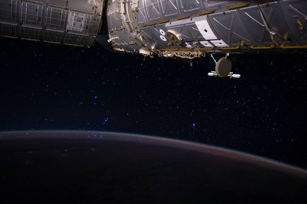 On June 23, 2014, Expedition 40 Flight Engineer Reid Wiseman captured this image which connects Earth to the International Space