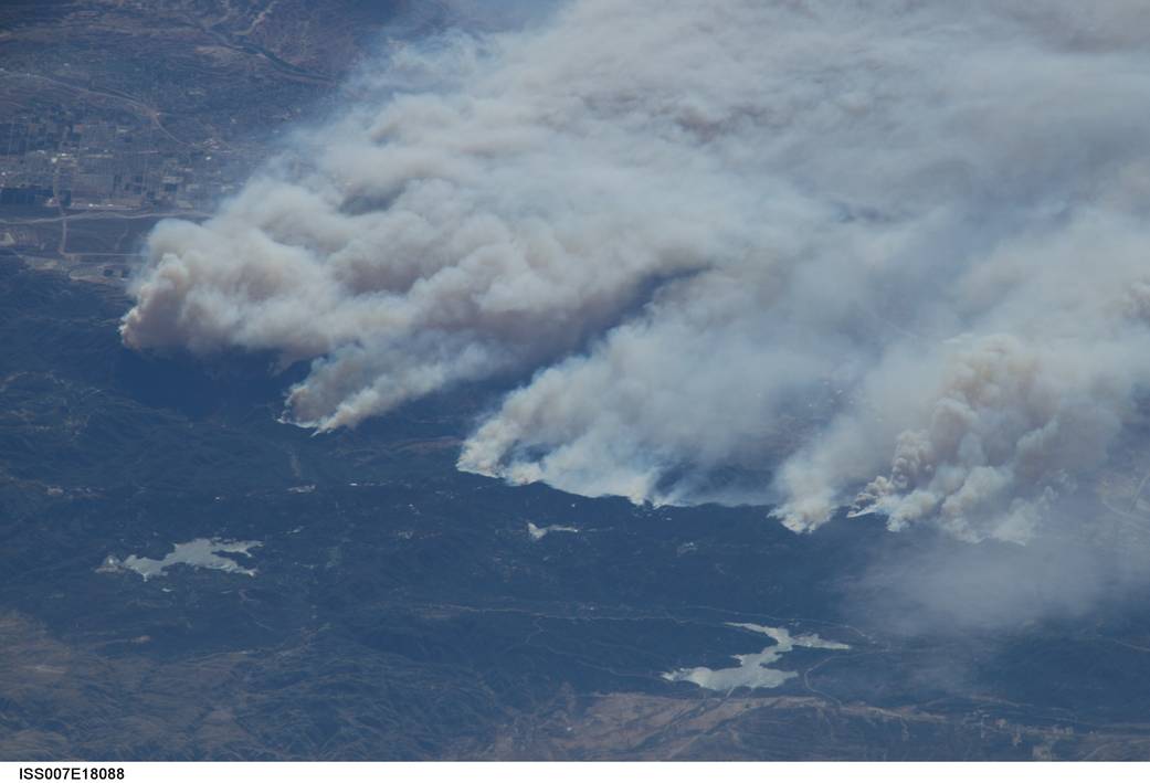 Heavy smoke from wildfires in the California forest photographed from low Earth orbit