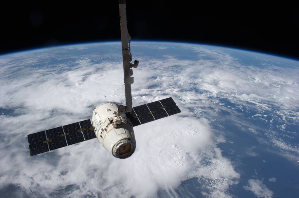 SpaceX Dragon just before being released by the Canadarm2