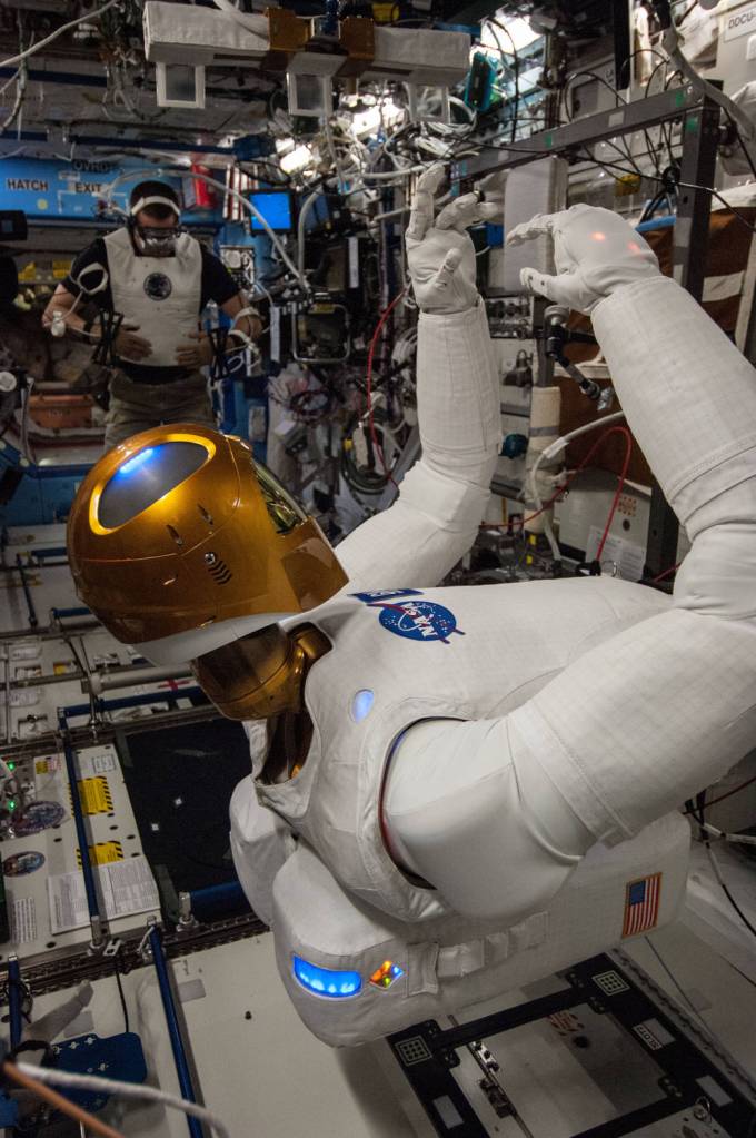 Astronaut Chris Cassidy and Robonaut 2