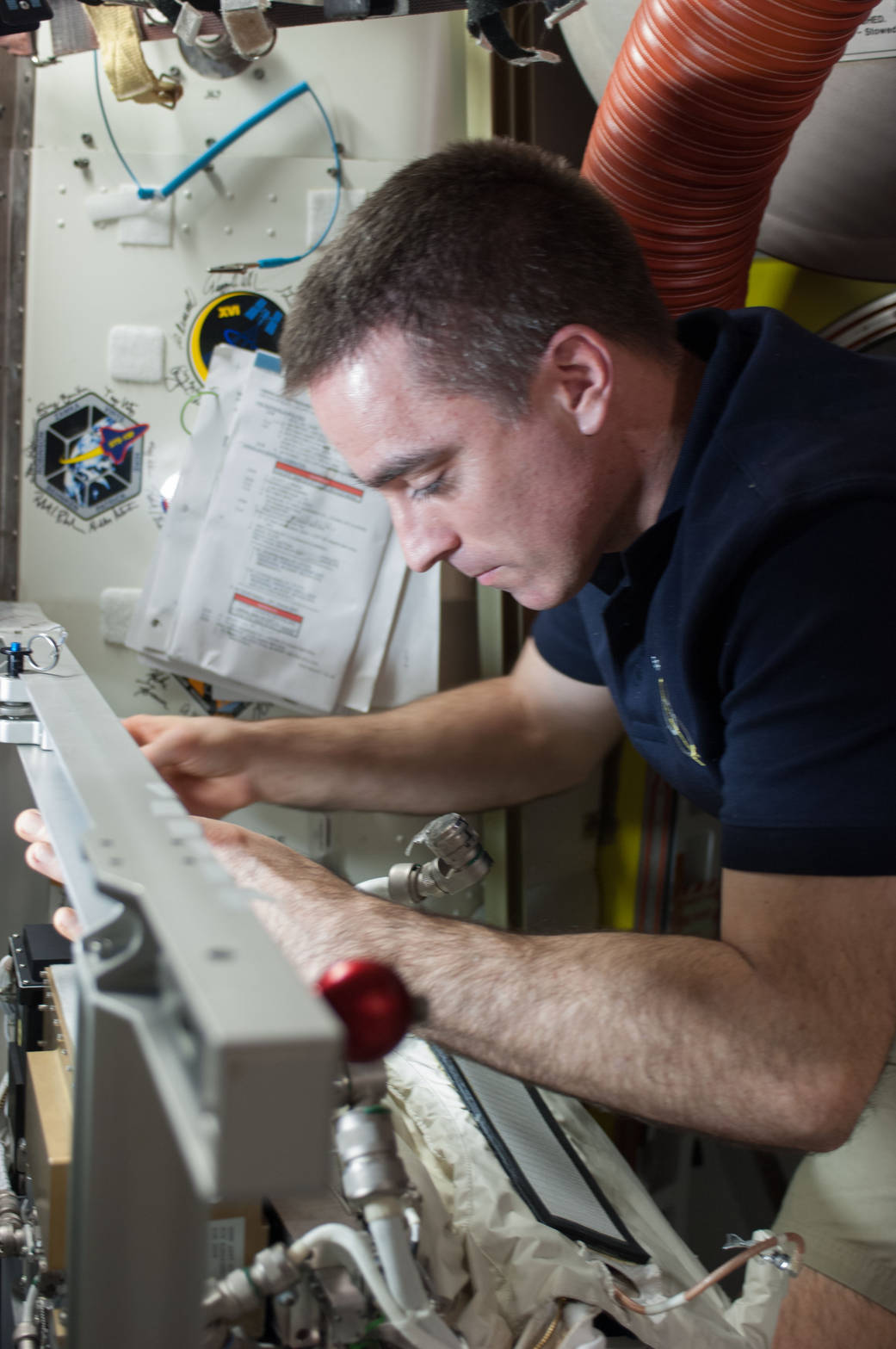 Chris Cassidy Works on a Spacesuit