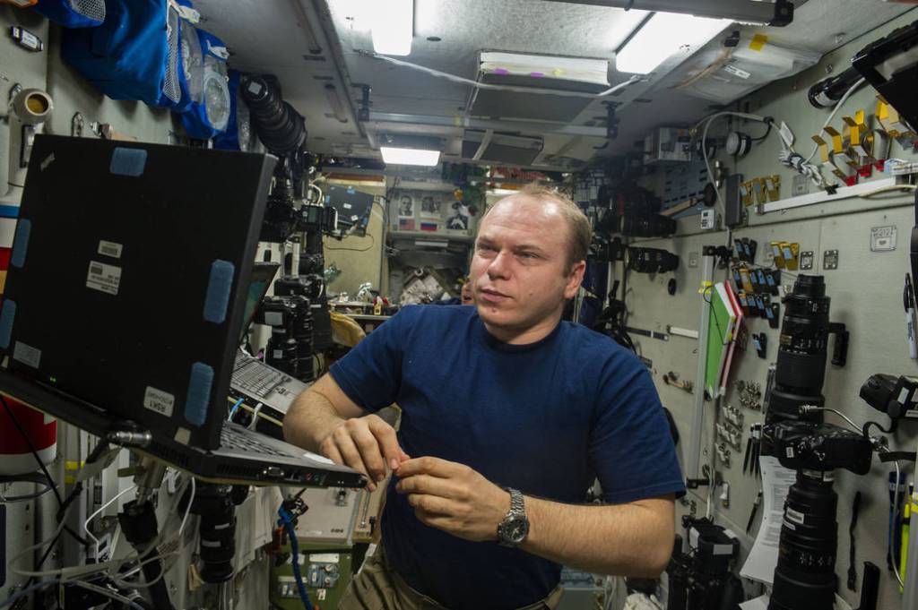 Oleg Kotov Looks at a Computer Monitor