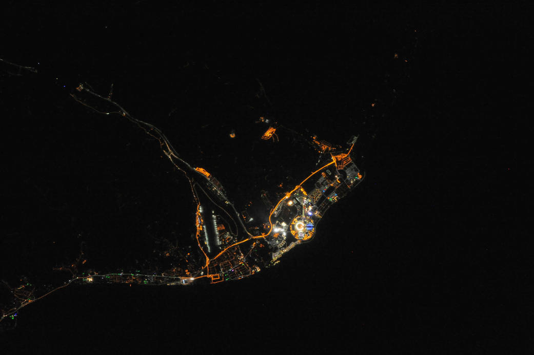 Photograph taken from the ISS showing Sochi Olympic Park. Fisht Stadium and the flame are visible.
