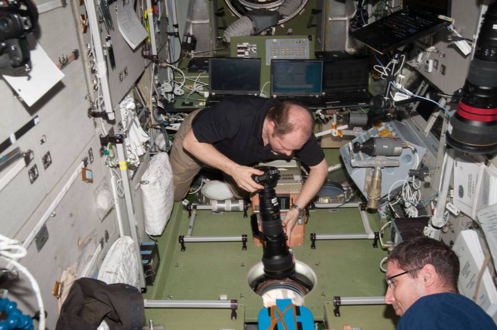 Oleg Kotov Aims a Camera