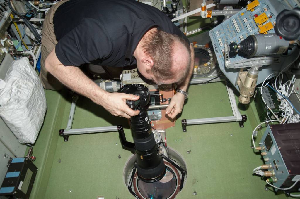 Oleg Kotov Aims a Camera