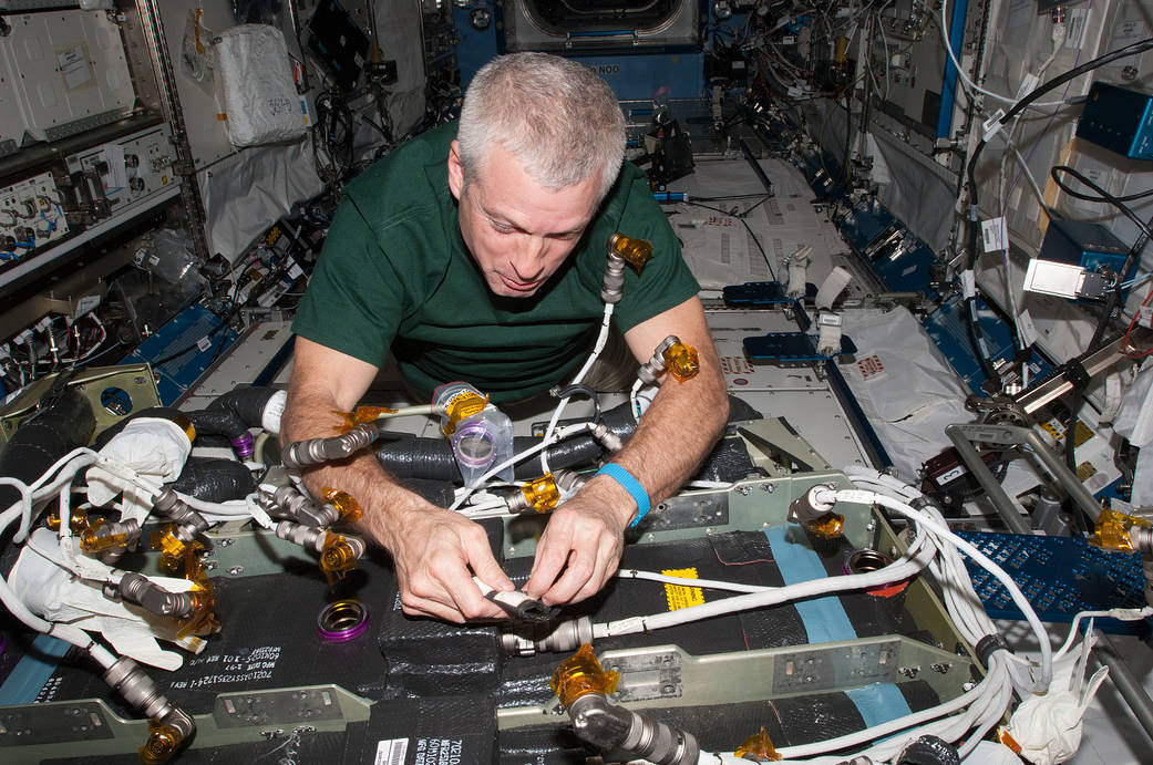 Astronaut Steve Swanson Performs CDRA Maintenance