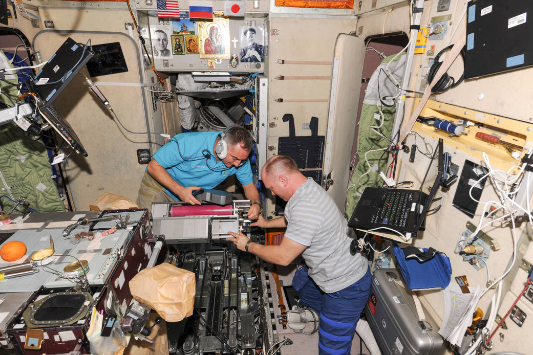 Station Cosmonauts Work on Treadmill