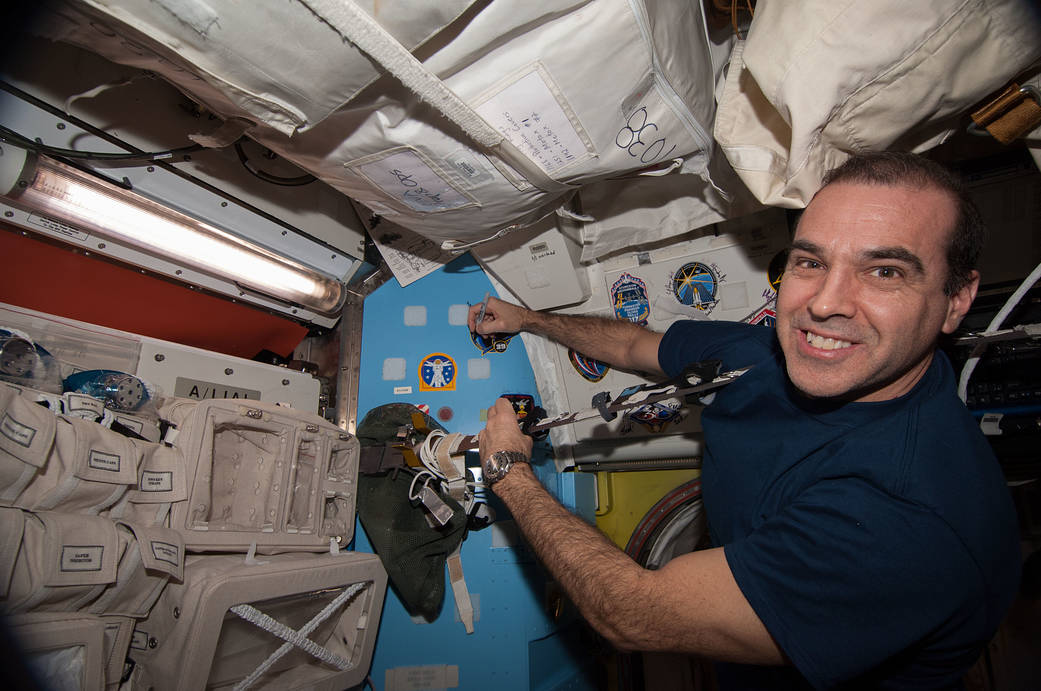 Rick Mastracchio Places Crew Patch on Quest Airlock