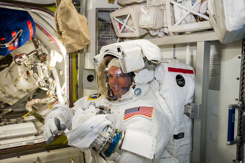 NASA astronaut Reid Wiseman checks his spacesuit in preparation for the first Expedition 41 spacewalk in this image, posted to s