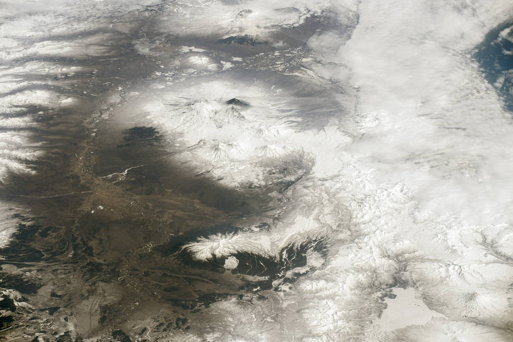 Image taken from space of mountain range with active volcanoes