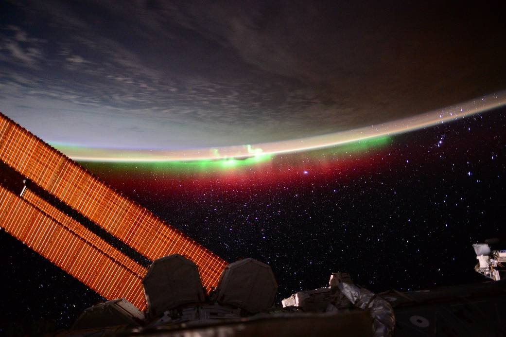 Night Earth Observations image taken by Expedition 44 crewmember, Scott Kelly. Green aurora is visible with a backdrop of stars.