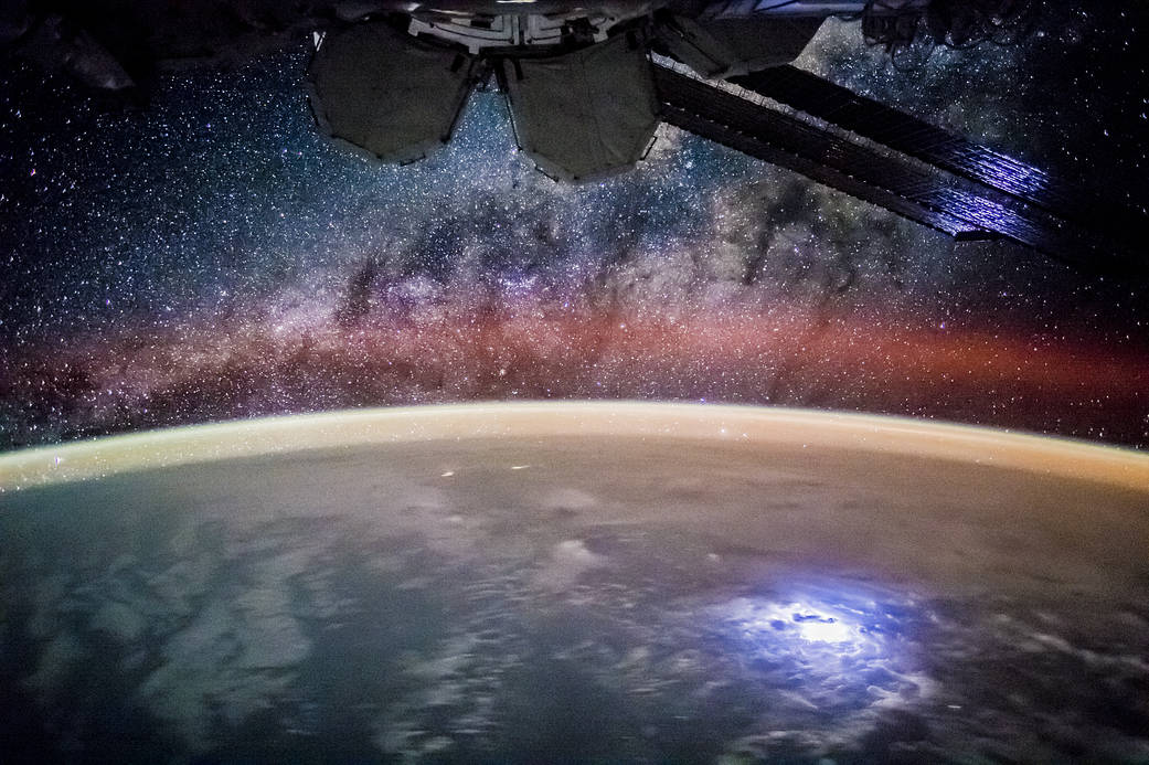 Starry sky and night lights of Earth photographed from low Earth orbit