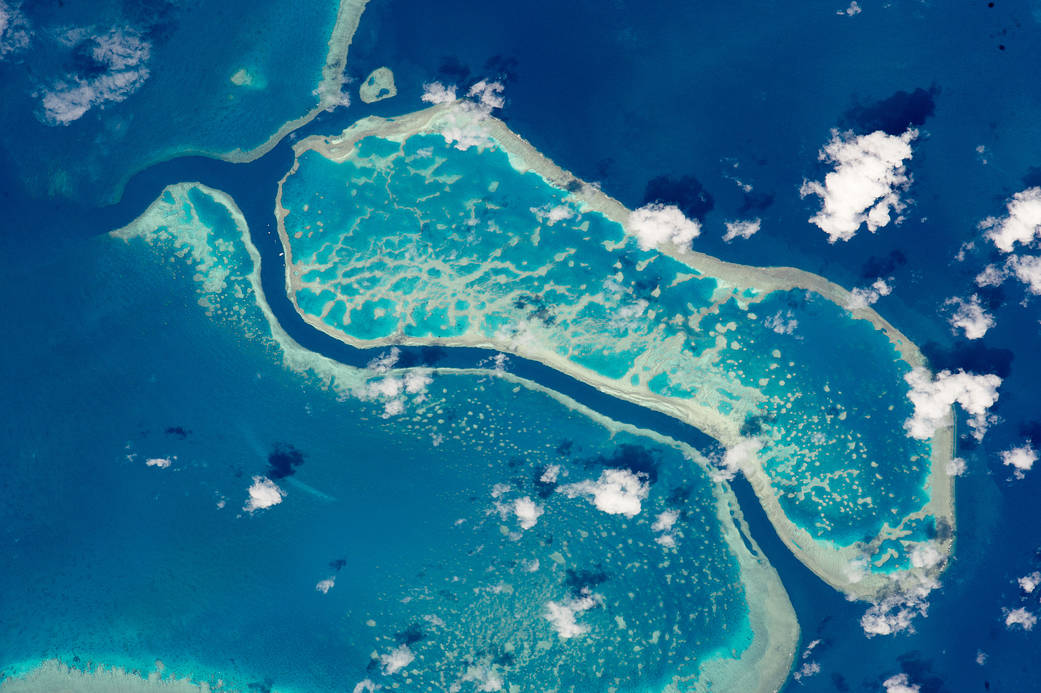 Image from orbit of barrier reef in blue ocean water