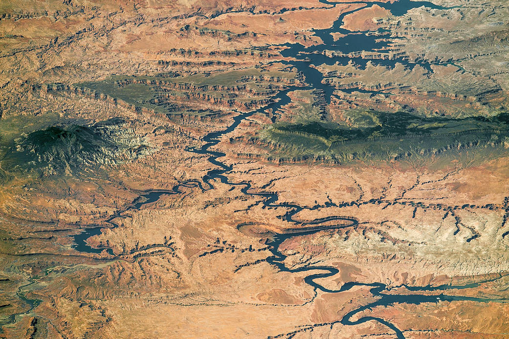 View of lake on Colorado River and terrain from low Earth orbit