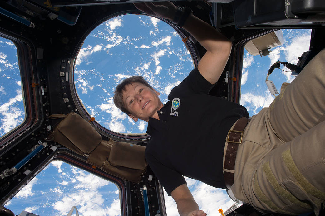 View of Expedition 50 Flight Engineer Peggy Whitson in the cupola.