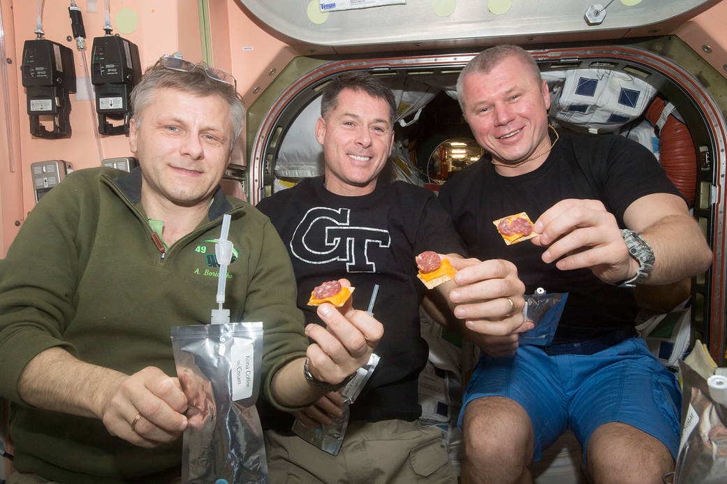 Crew Members Share a Snack