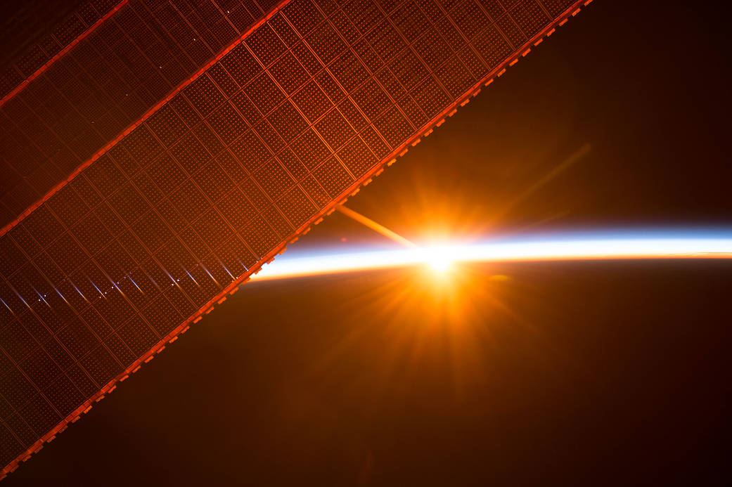 The International Space Station orbits toward the sun to experience one of the 16 sunrises the crew has every day